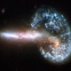 Arp 148, a galaxy resulting from the violent merger of two galaxies that have collided.